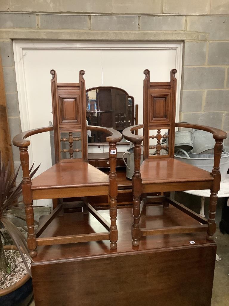 A pair of late Victorian walnut elbow chairs, width 60cm, depth 46cm, height 106cm